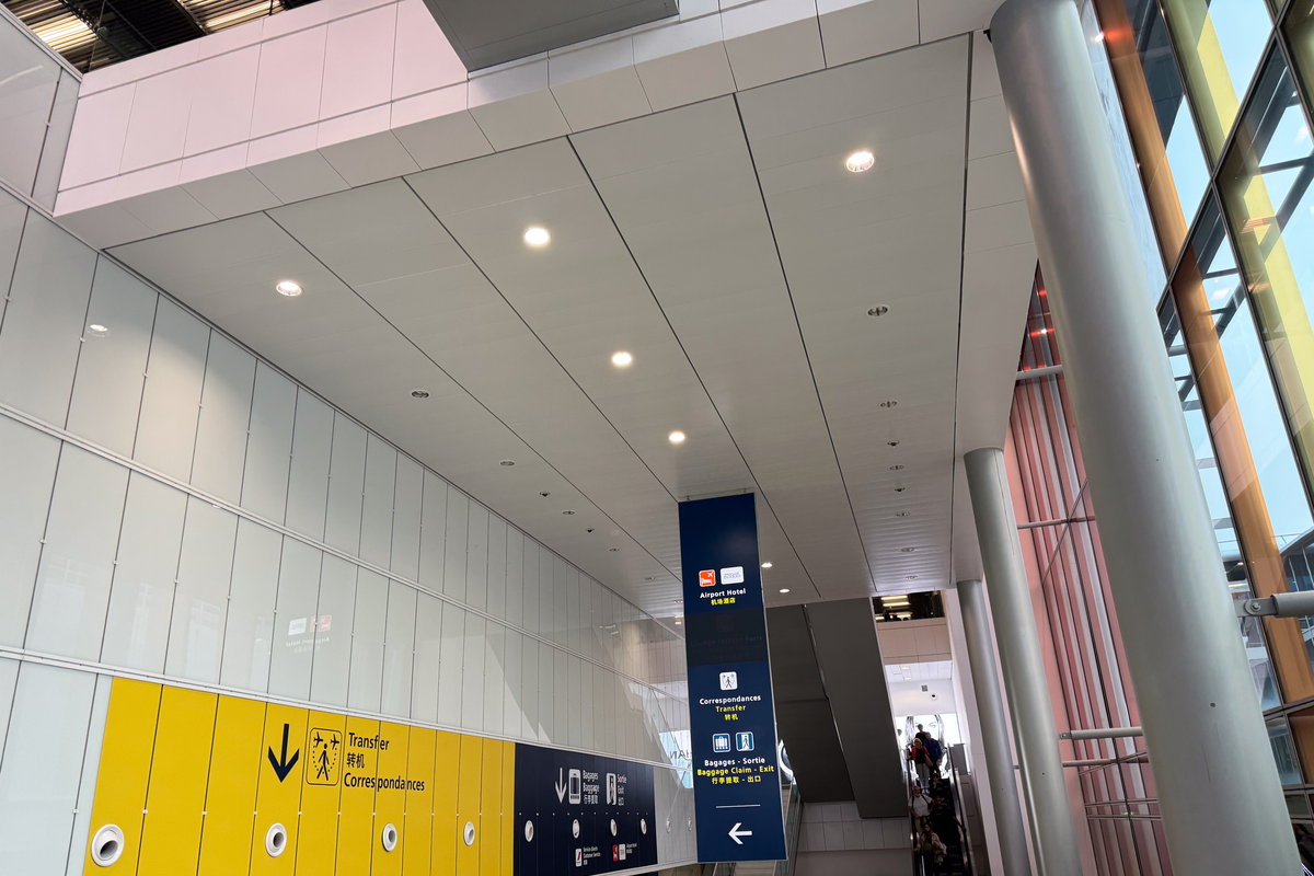 Charles de Gaulle Airport wayfinding signage displaying terminal directions in the Frutiger typeface